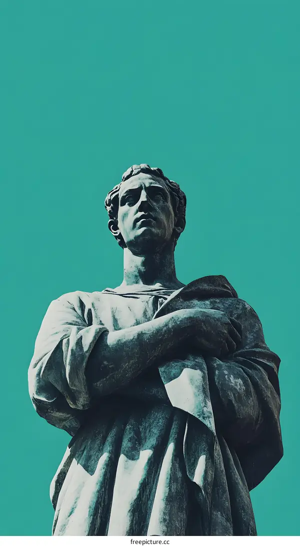 A Low Angle View of a Bronze Statue of a Man in a Pose of Thought