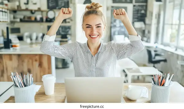 Woman Celebrating Success in a Modern Workspace
