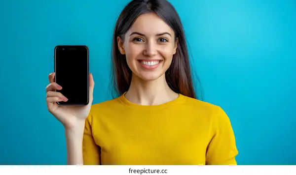 Young Woman Showing Smartphone With Blank Screen