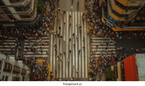 Crowded city street with people crossing the road