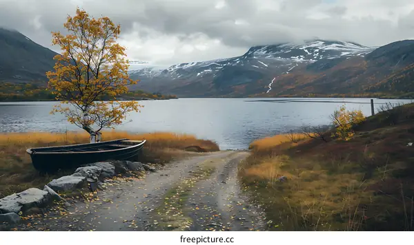 Scenic Autumn Landscape with a Boat by a Lake in the Mountains