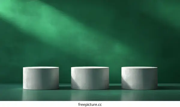 Green Background with Gray Cylindrical Display Stands