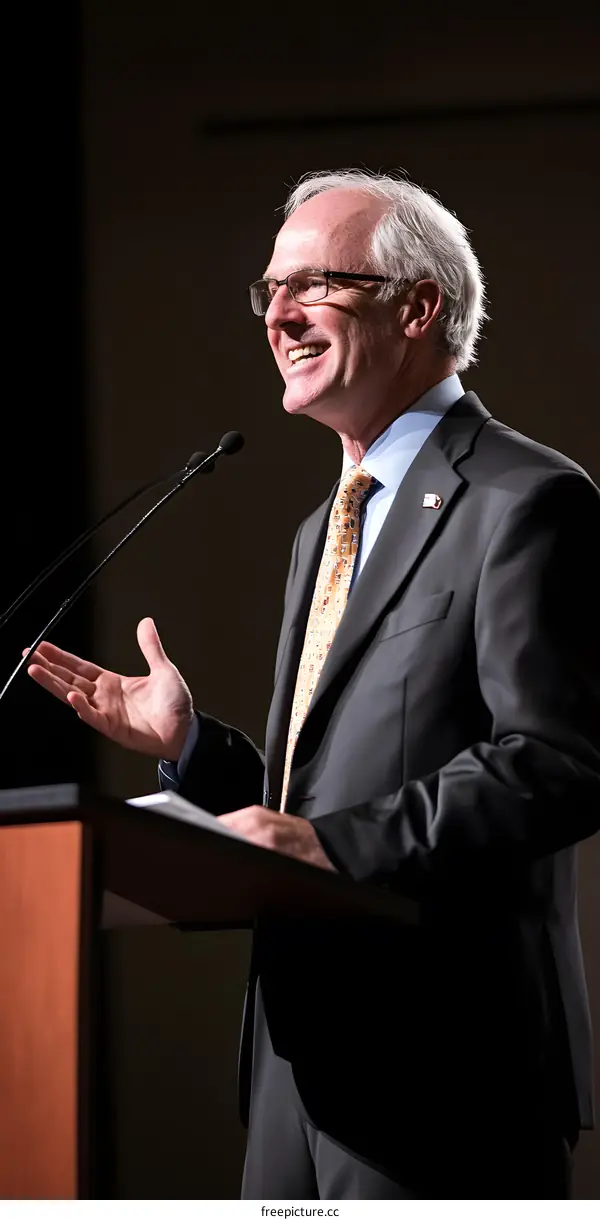 Smiling Man Giving a Speech at Podium