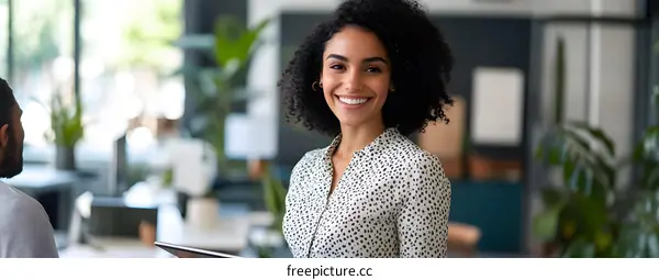 Smiling African American Businesswoman with Tablet in Office