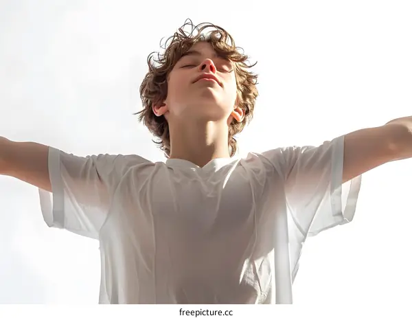 Ecstatic Teenager with closed eyes and open arms