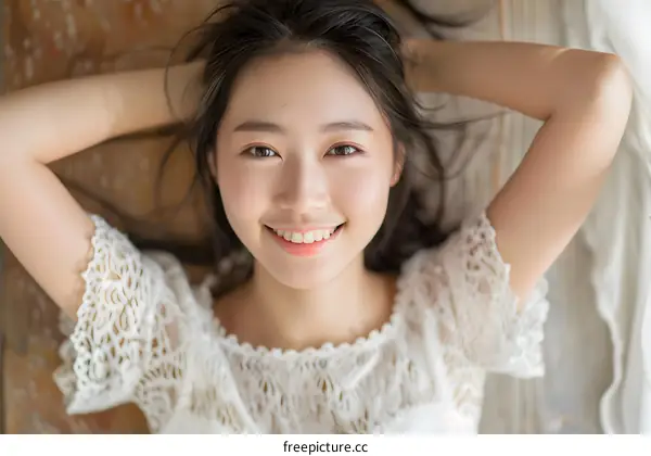 A Young Woman Lying Down with a Smile