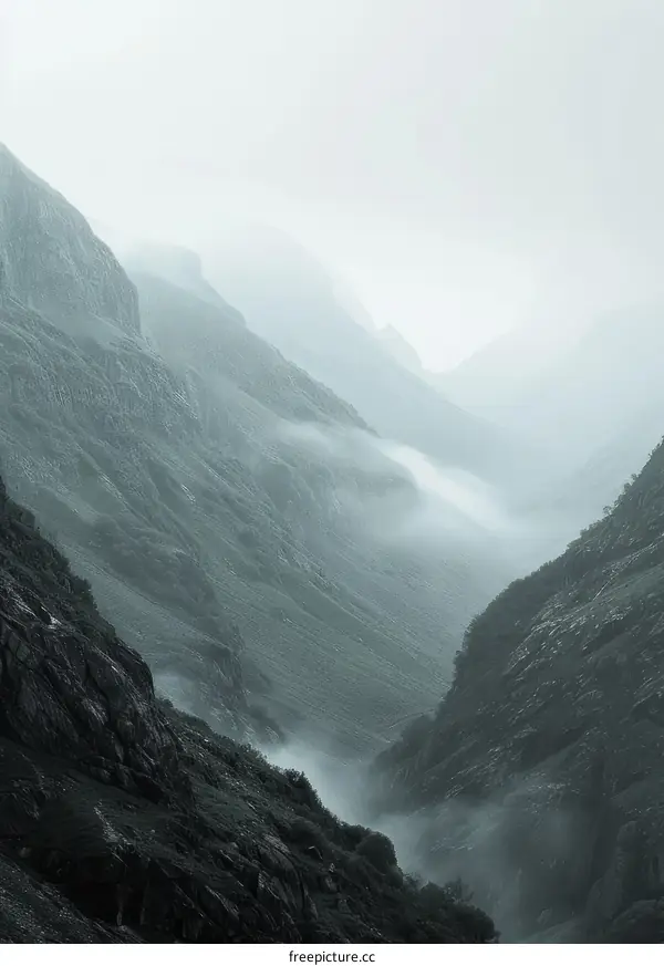 Misty mountains and valley landscape