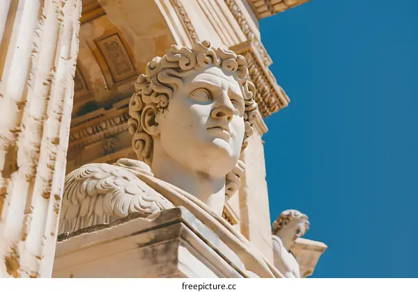 Close Up of a Stone Sculpture of a Man With Curly Hair
