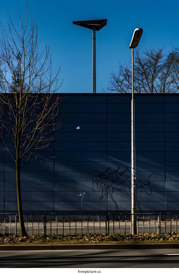 Street Light Pole And Graffiti On A Wall In Germany