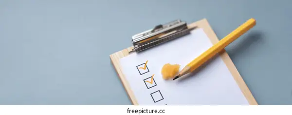 Checklist Clipboard with Pencil on Light Gray Background