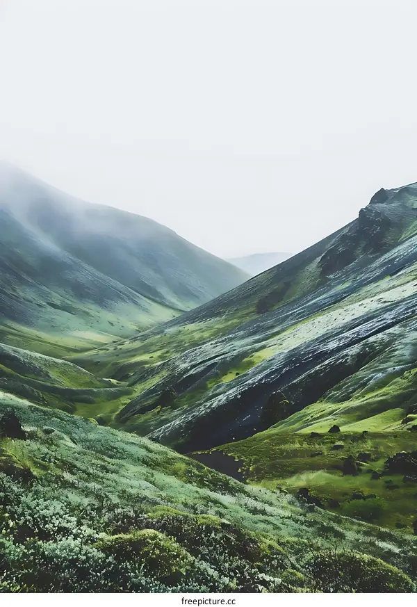 Green Hills and Foggy Sky in Icelandic Landscape