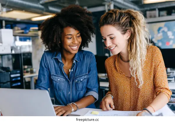 Two Diverse Colleagues Collaborating in Modern Office