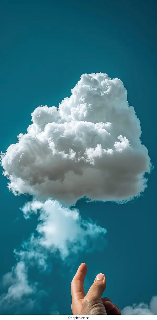 A hand holding a cloud in the sky