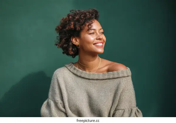 Portrait of a Smiling Woman in a Knitted Sweater