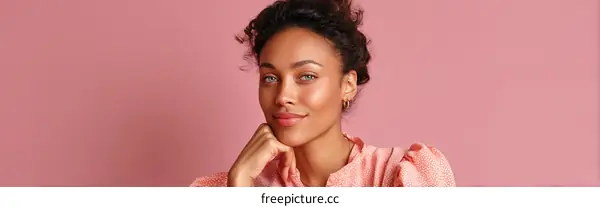 Beautiful Woman with Light Blue Eyes on Pink Background