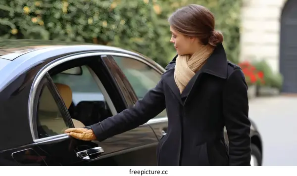 Elegant Woman Opening Car Door in Autumn