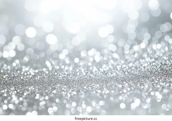 Silver glitter background with shiny sparkles