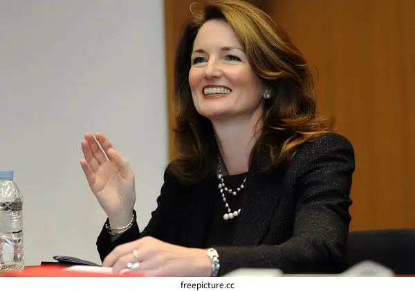 Smiling Business Woman Speaking at Conference