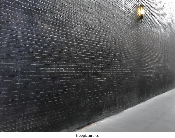 Dark Brick Wall Alleyway with a Lamp