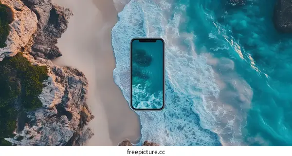 Aerial View of a Smartphone on a Beach with Ocean Waves