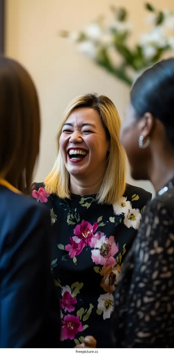 Smiling Woman With Blonde Hair In A Floral Dress