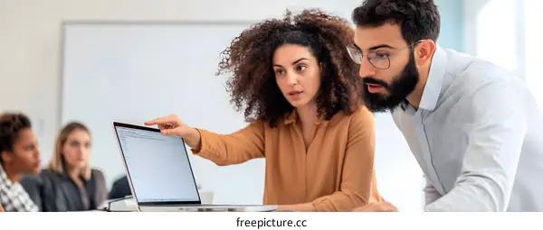 Two Business People Looking at a Laptop