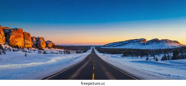 Winter Road Through Scenic Mountain Landscape