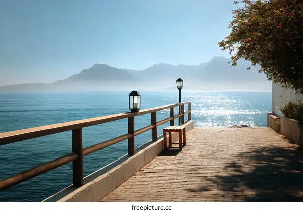 Tranquil Seaside Pier Path Under Sunny Skies