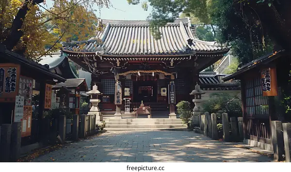 Traditional Japanese Temple with Ornate Roof and Stone Lanterns