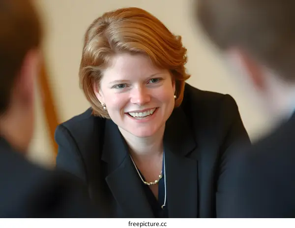 Smiling Businesswoman in Meeting