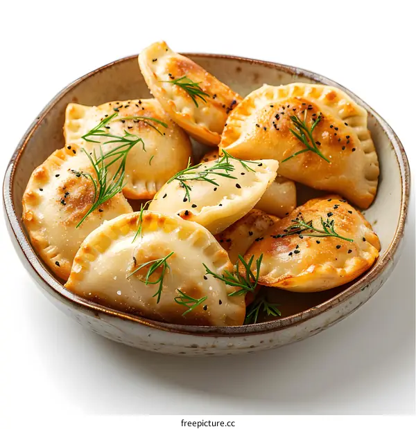 Fried dumplings with black sesame and dill in a bowl