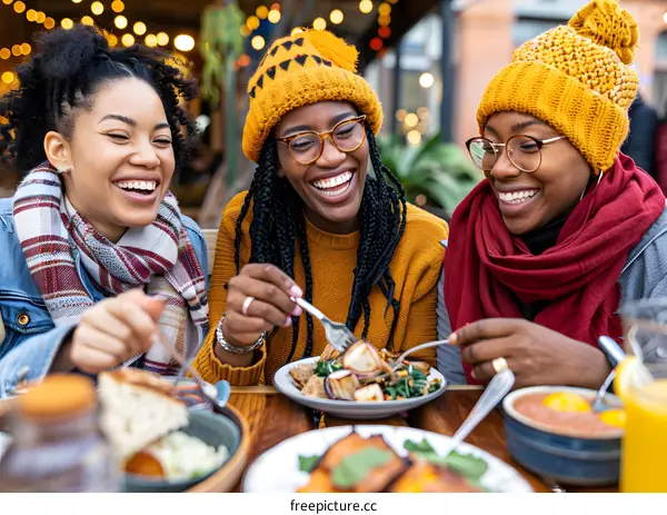Three Black Women Enjoying a Meal Together
