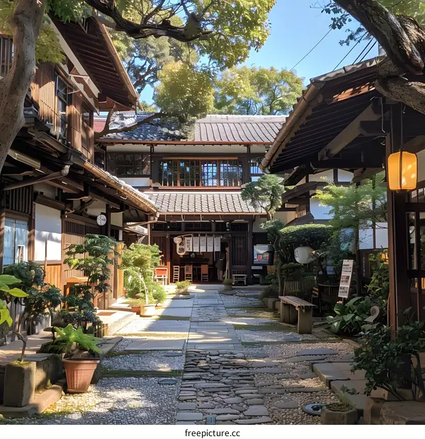 A traditional Japanese courtyard with a stone path and a wooden house