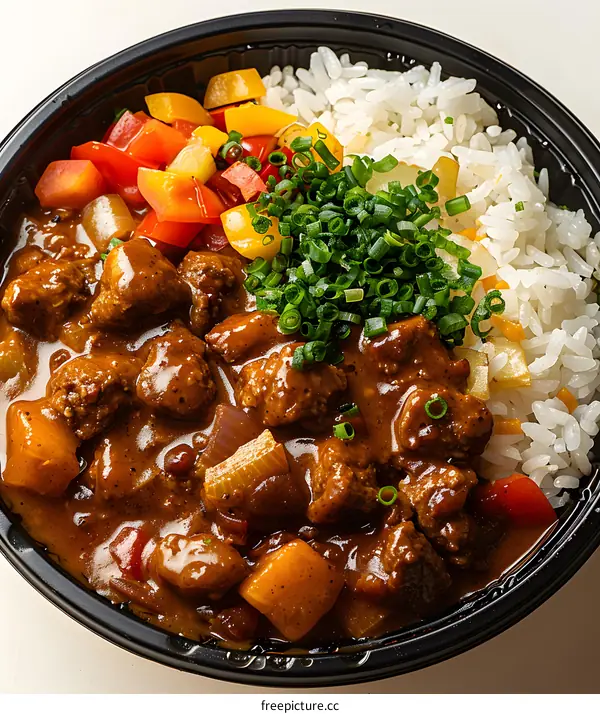 Curry Rice with Vegetables in a Black Bowl