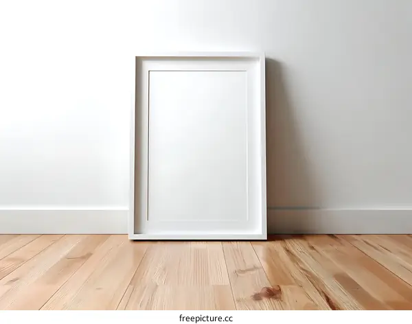 Empty White Picture Frame on Light Wood Floor