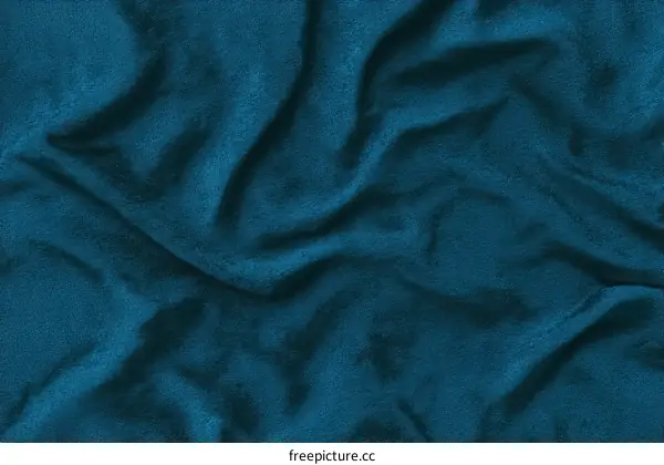 Close-up view of deep teal fabric texture