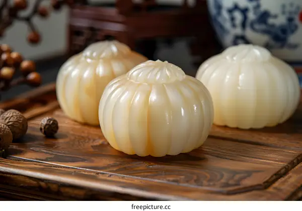Closeup of Three White Jade Gourds on a Wooden Tray