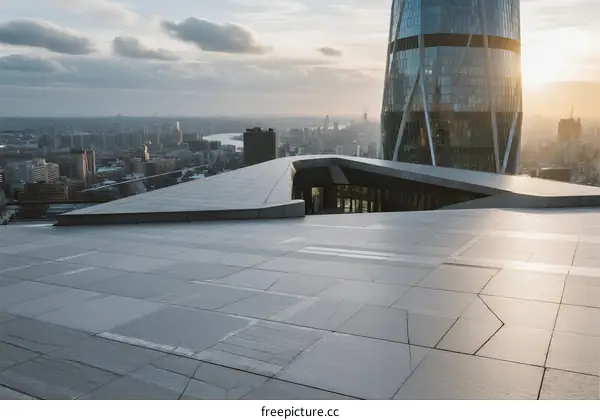 Modern skyscraper rooftop with cityscape view at sunset