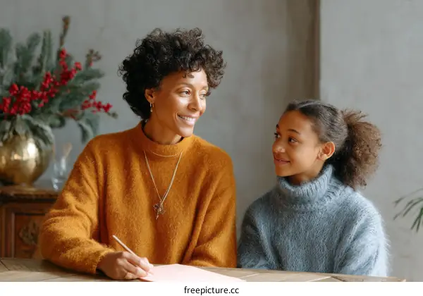 Mother and Daughter Writing Letters during Christmas Season