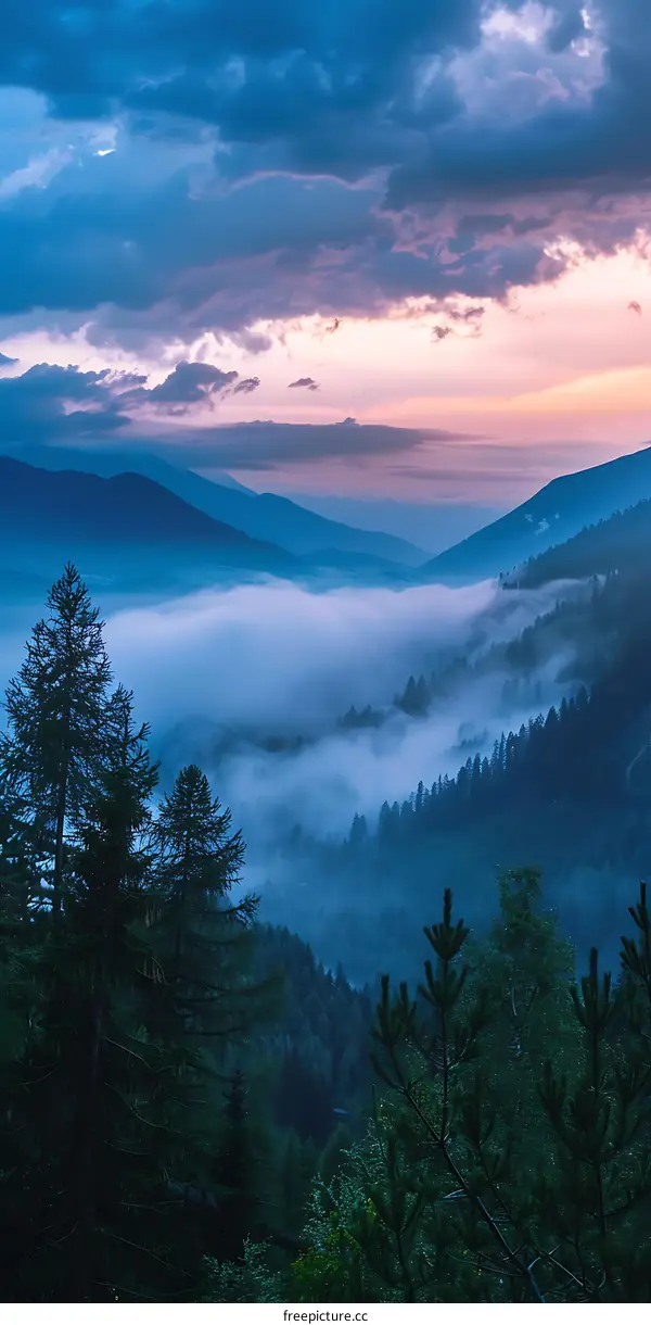 Mountain Valley Landscape With Fog and Clouds at Sunset