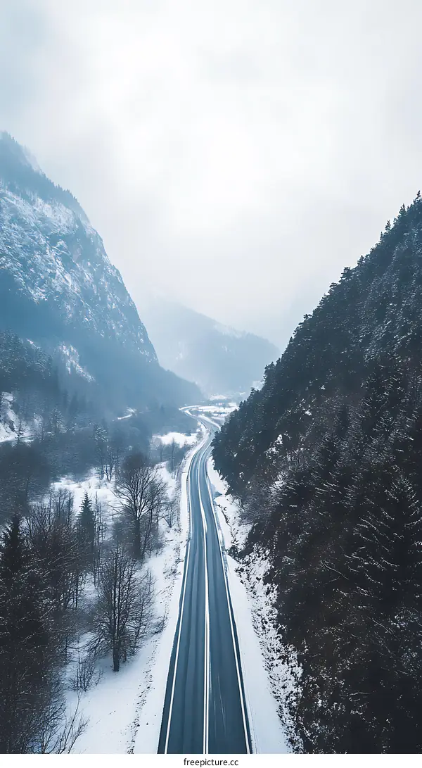 Snowy Mountain Road with Clear Sky