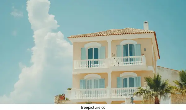 Pastel Yellow Building Under a Sunny Sky