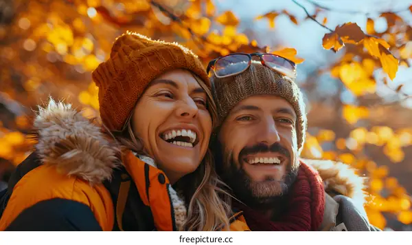 Happy couple hiking in the fall forest