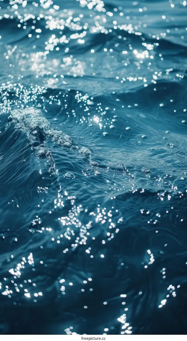 Deep Blue Ocean Water Surface with Glistening Sunlight