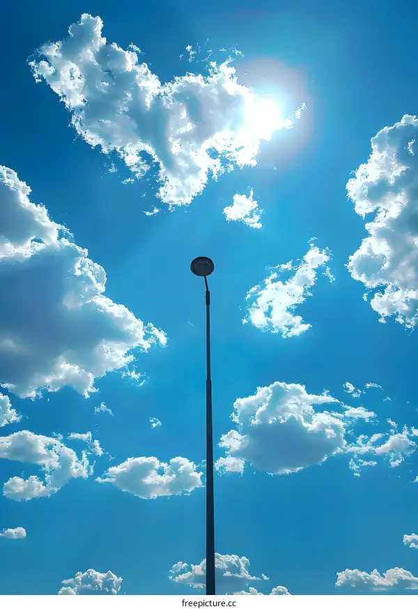 Blue sky and white clouds with street lamp
