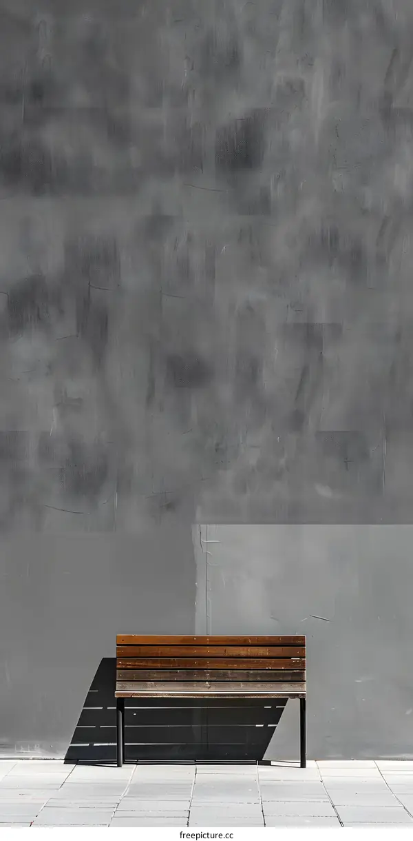 Wooden Bench Against A Grey Wall