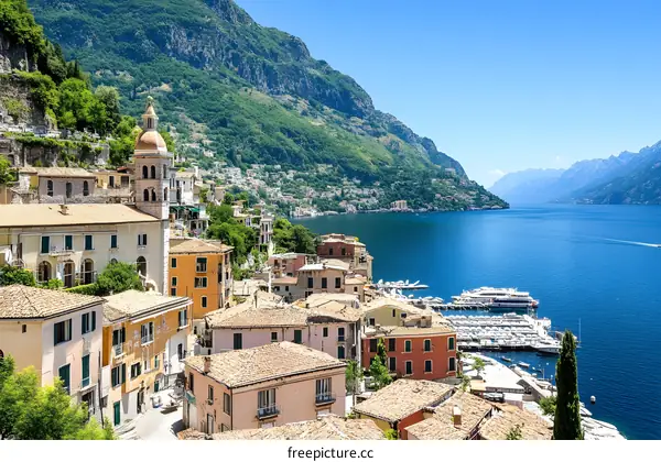 Aerial View of Town on Lake with Mountains in Background