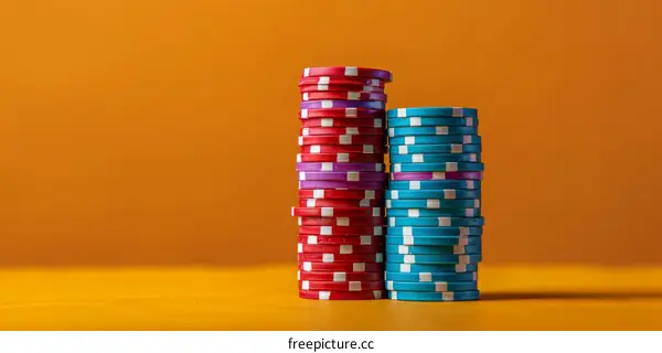 Red and Blue Casino Chips Stacks on Orange Background