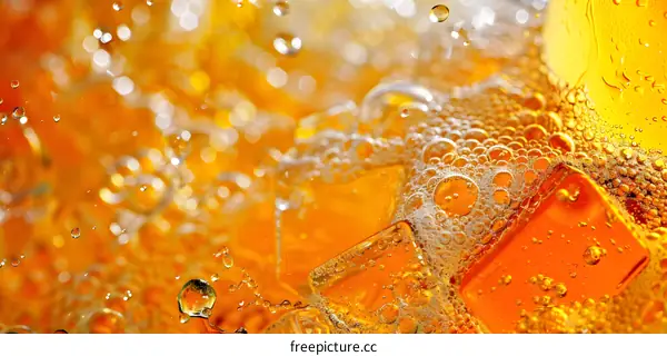 Close Up of Ice Cubes in Orange Soda