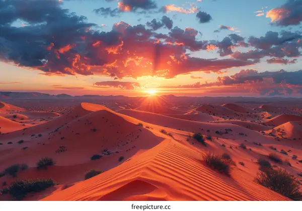 A Stunning Sunset Over a Vast Sandy Desert Landscape
